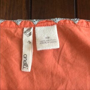 Orange top. Silver tread work